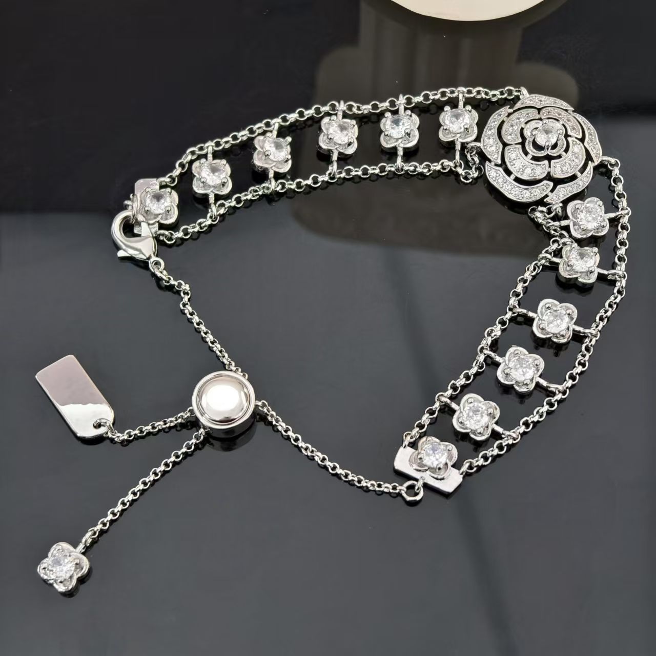Light luxury retro style camellia hollow full diamond tassel bracelet female new style niche temperament tassel small fragrance style fashion