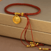 Ancient gold Tibetan style yellow god of wealth round plate hand-woven rope bracelet tassel broken gold zodiac year red rope bracelet