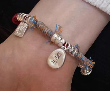 Peace and joy bell transfer braided red rope female niche retro exquisite high-end silver bracelet gift